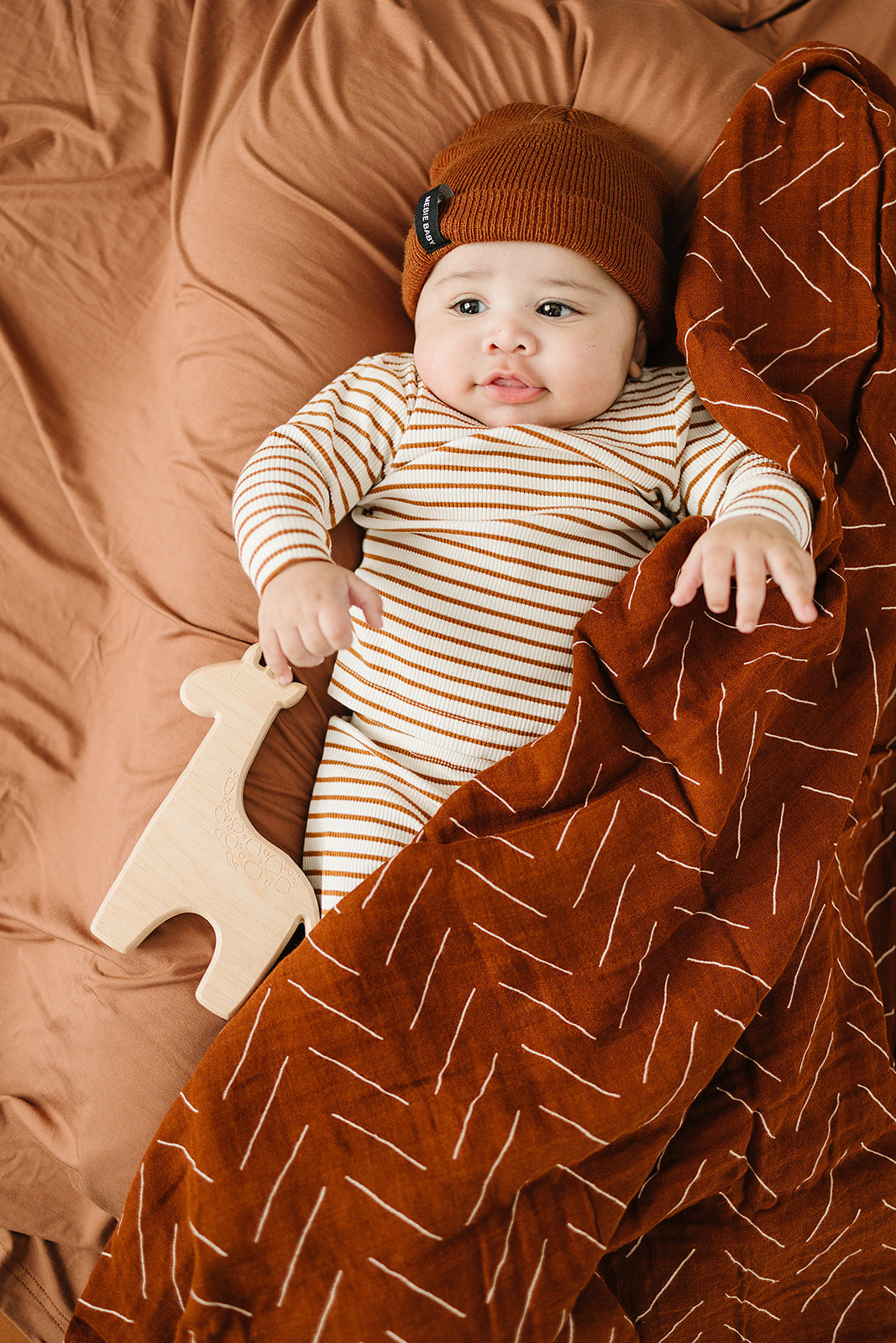 Mebie Baby Muslin Swaddle - Rust Mudcloth - Atara & Co