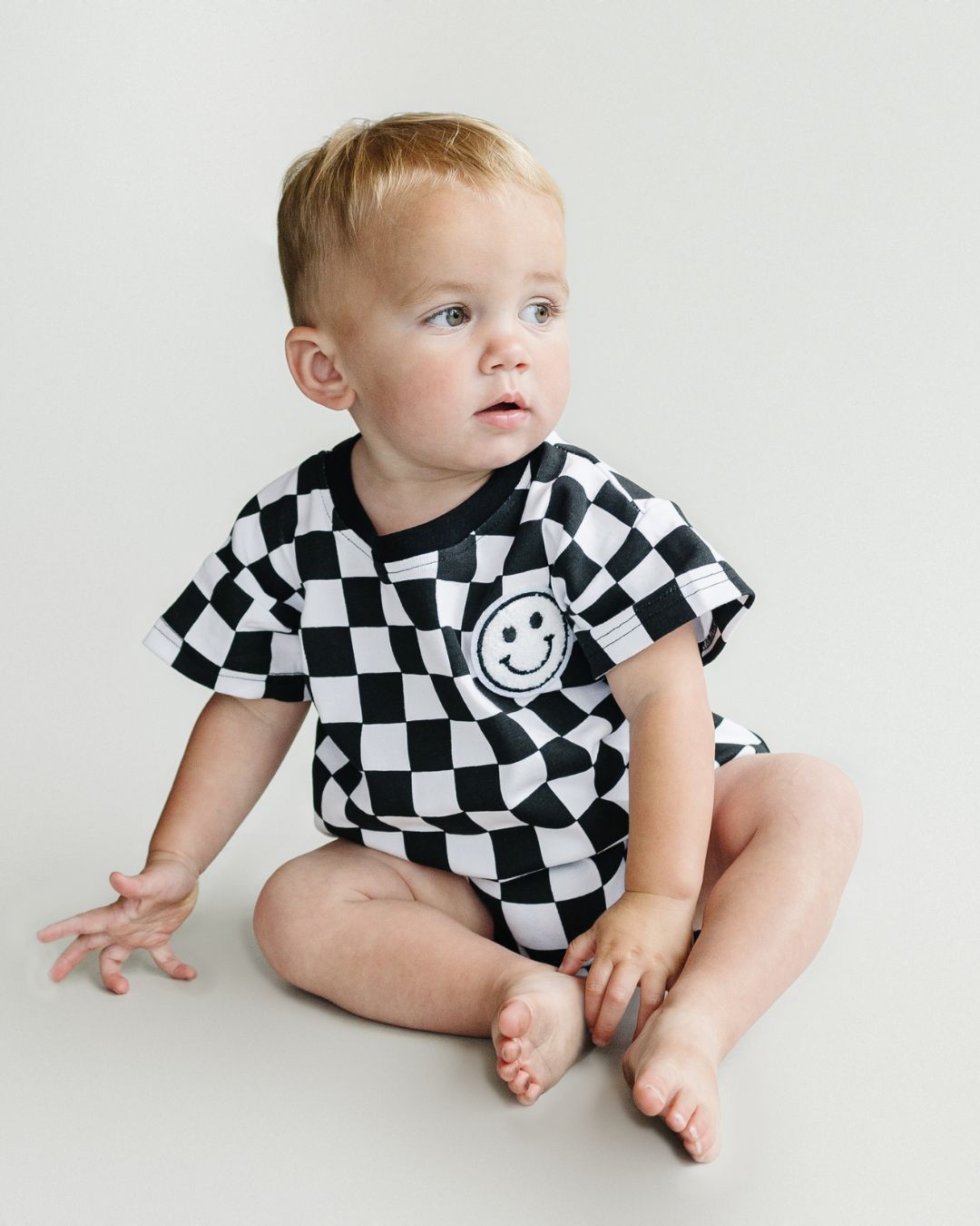 LPK Short Sleeve Bubble Romper - Checkered Smiley Black - Atara & Co