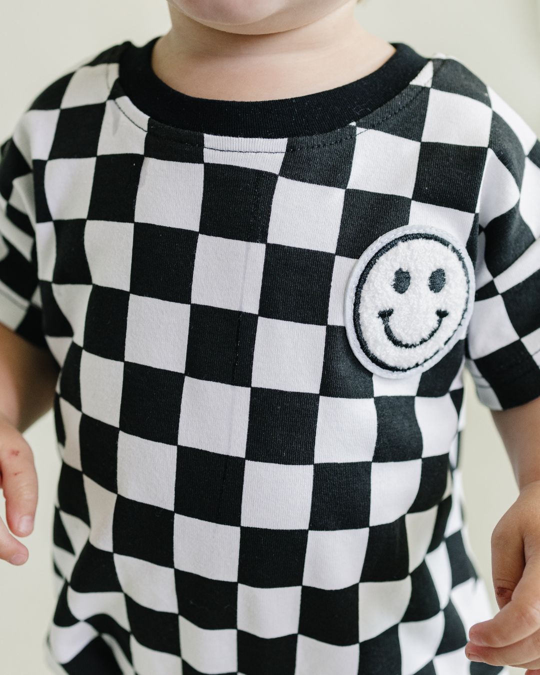 LPK Short Sleeve Bubble Romper - Checkered Smiley Black - Atara & Co