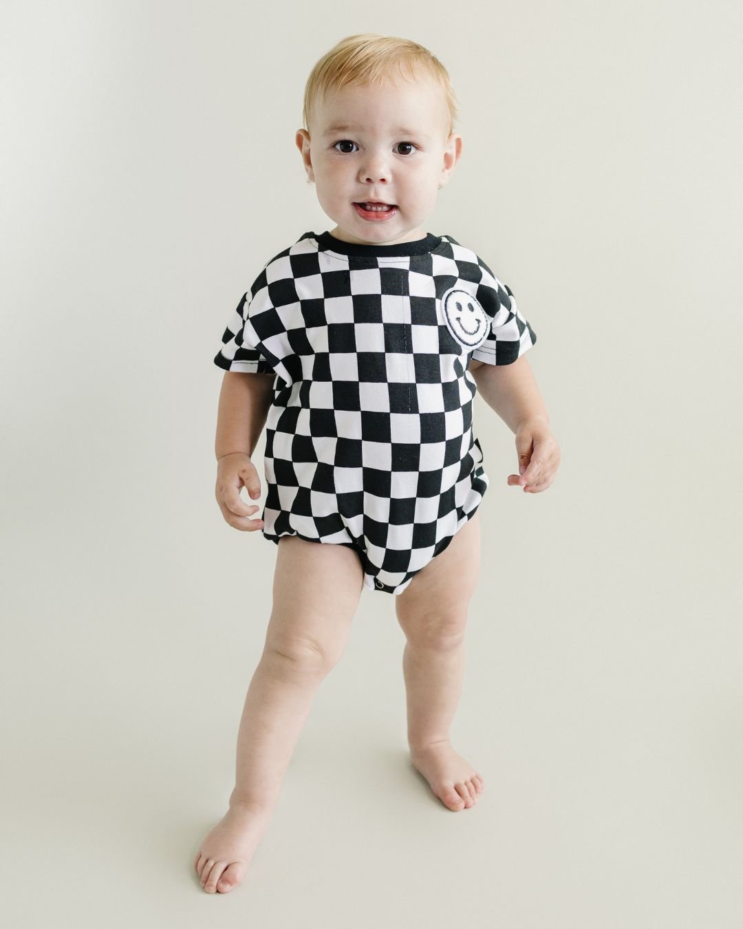 LPK Short Sleeve Bubble Romper - Checkered Smiley Black - Atara & Co