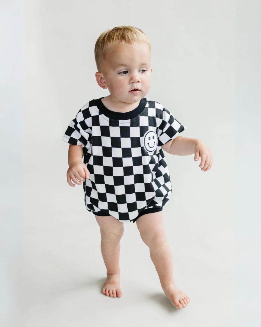 LPK Short Sleeve Bubble Romper - Checkered Smiley Black - Atara & Co