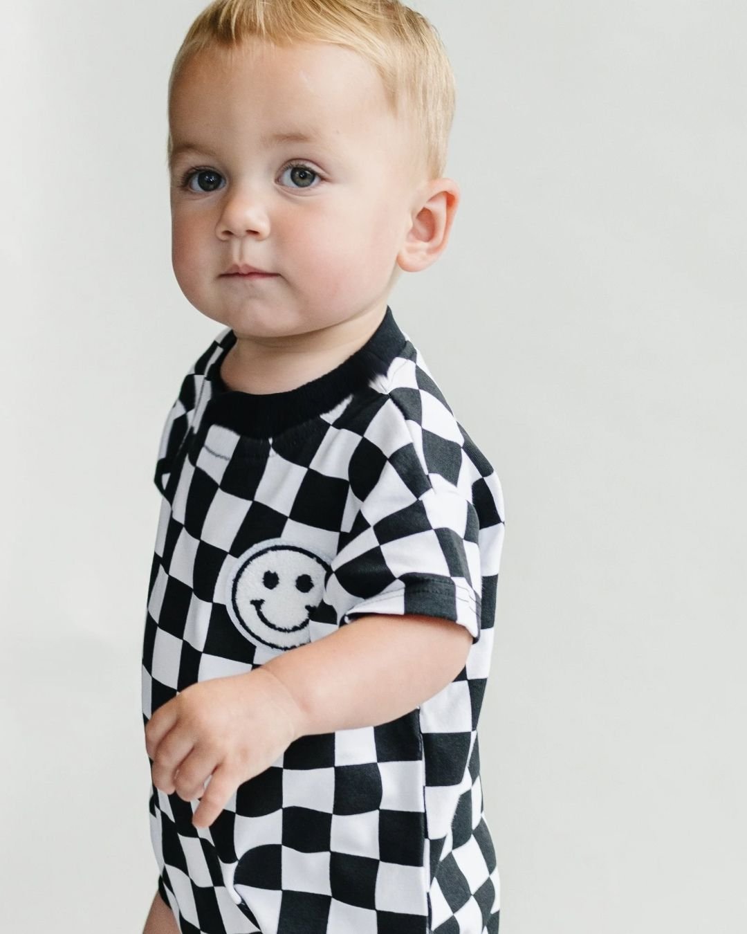 LPK Short Sleeve Bubble Romper - Checkered Smiley Black - Atara & Co