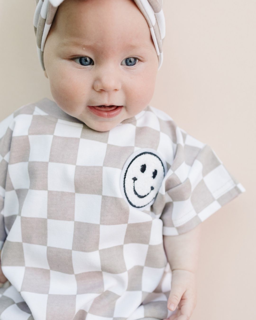 LPK Short Sleeve Bubble Romper - Checkered Smiley Latte - Atara & Co