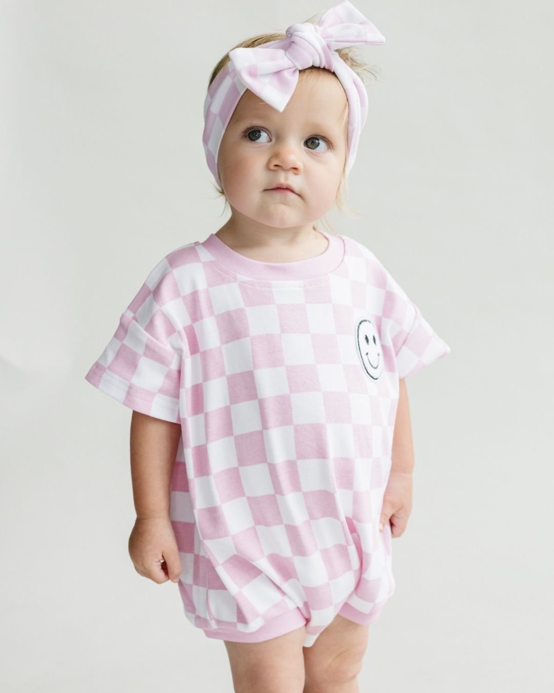 LPK Short Sleeve Bubble Romper - Checkered Smiley Pink - Atara & Co