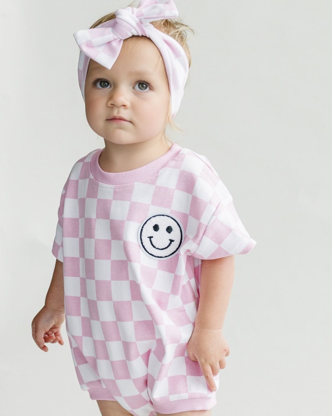 LPK Short Sleeve Bubble Romper - Checkered Smiley Pink - Atara & Co